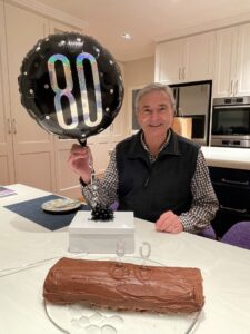 John Fisher with 80th balloon at home
